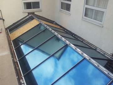 Commercial installation of an ATS aluminium thermally broken 28mm double glazed roofing system with a bespoke solarfilm to allow employee welfare (reduction of computer screen glare)
